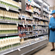 : Queen Elizabeth II, accompanied by Waitrose Marketing Director Rupert Thomas, (R) looks around a Waitrose supermarket during a visit to the town of Poundbury on October 27, 2016 in Poundbury, Dorset. Photo via Getty Images.